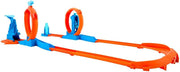 Hot Wheels toy car track set with triple loops and a 1:64 scale vehicle on a colorful track layout.