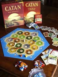 Playzokids Catan 6th Edition board game with trade, build, and settle pieces on a colorful game board.