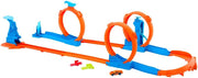 Hot Wheels toy car track set with triple loops and a 1:64 scale vehicle on a colorful track layout.
