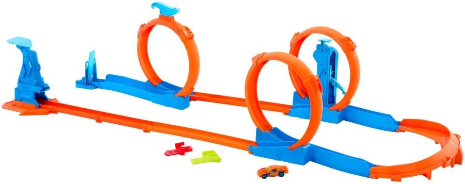 Hot Wheels toy car track set with triple loops and a 1:64 scale vehicle on a colorful track layout.