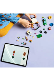 LEGO 42642 Friendship Movie Night set featuring LEGO minifigures and detailed movie-themed accessories on a colorful background.