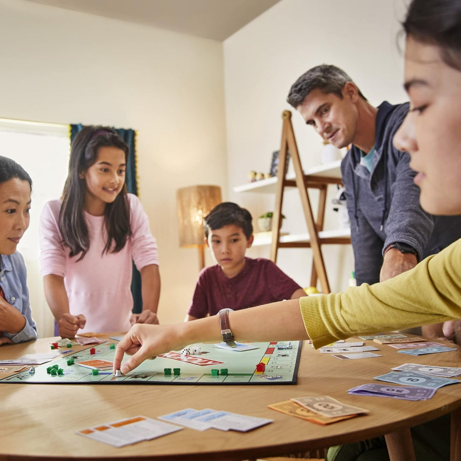Hasbro Monopoly family board game with colorful game board, tokens, cards, and property pieces for fun gameplay.