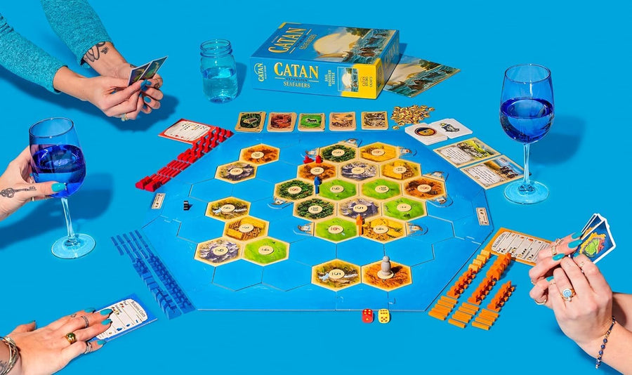 Catan Seafarers expansion set for the Catan board game, featuring ships and game pieces on a colorful background.