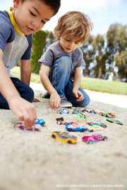 Set of 8 Hot Wheels 1:64 scale basic die-cast cars in various vibrant colors arranged on a surface.