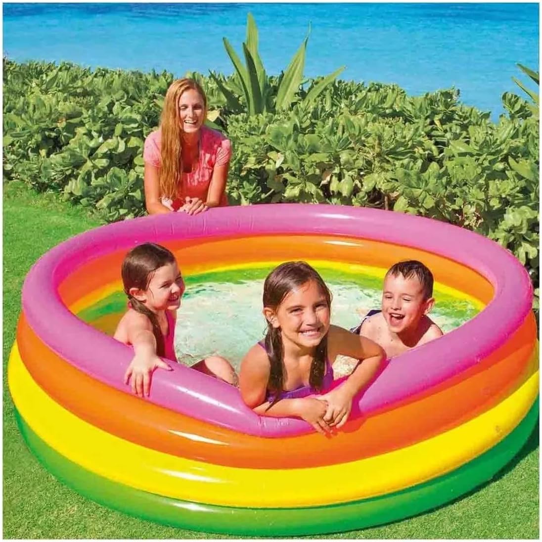 Playzokids inflatable round swimming pool for children with four colorful rings, perfect for outdoor water fun.