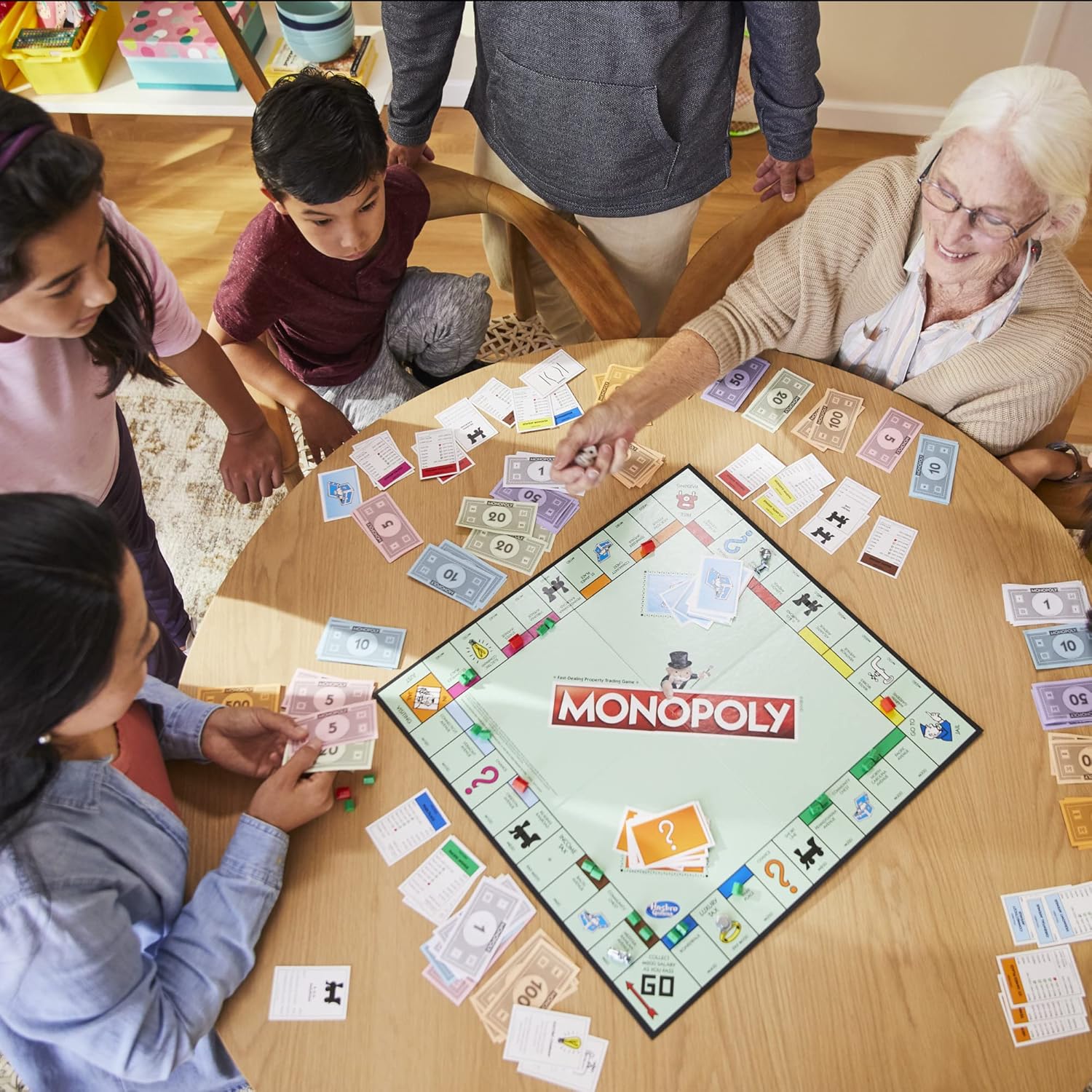 Hasbro Monopoly family board game with colorful game board, tokens, and property cards for fun family gaming sessions.