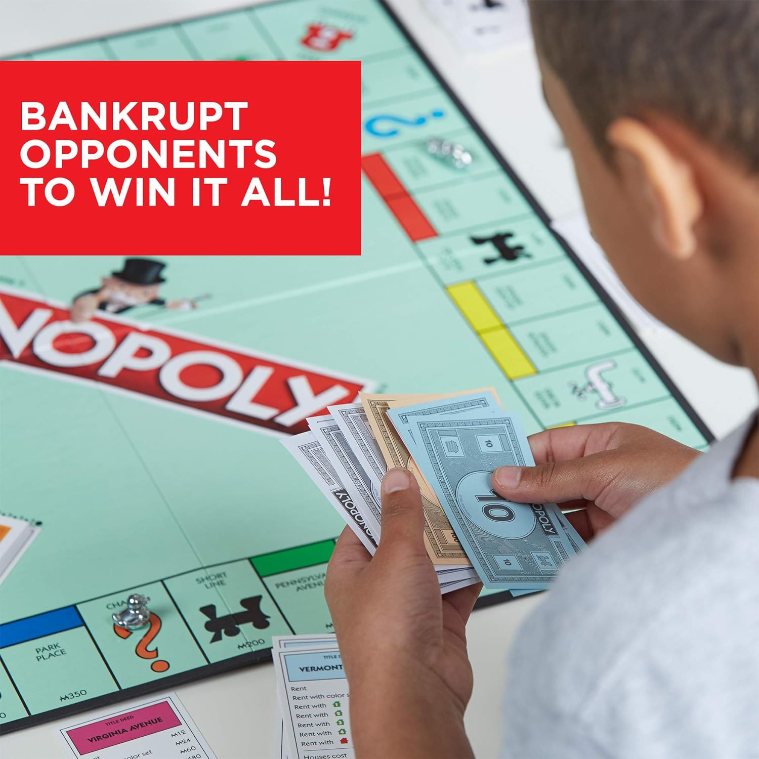 Hasbro Monopoly family board game with colorful game board, currency, and playing pieces for fun property trading and real estate gameplay.