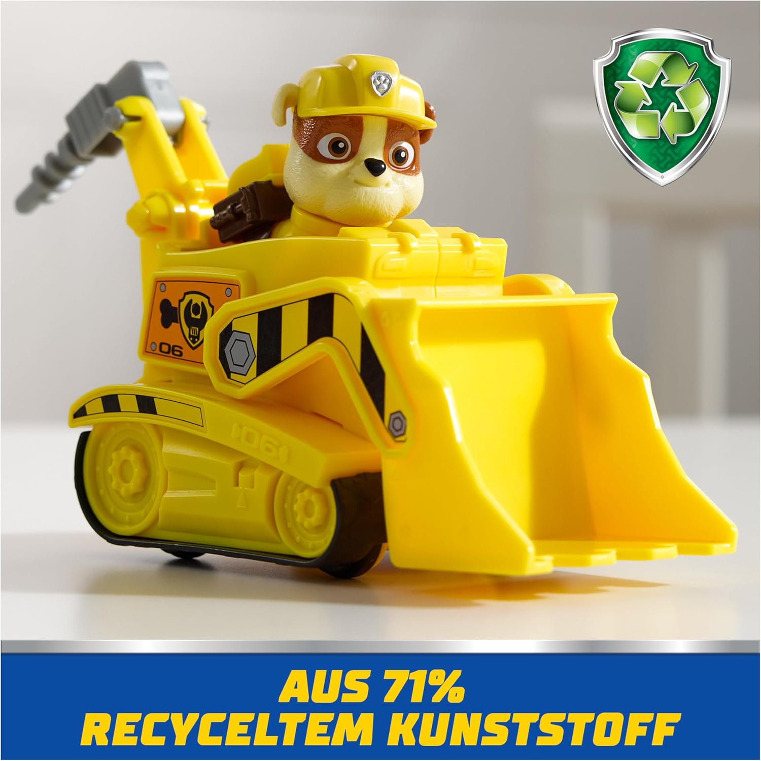 Paw Patrol Rubble bulldozer toy with Rubble figure from Spin Master, featuring detailed vehicle and character for kids' play.