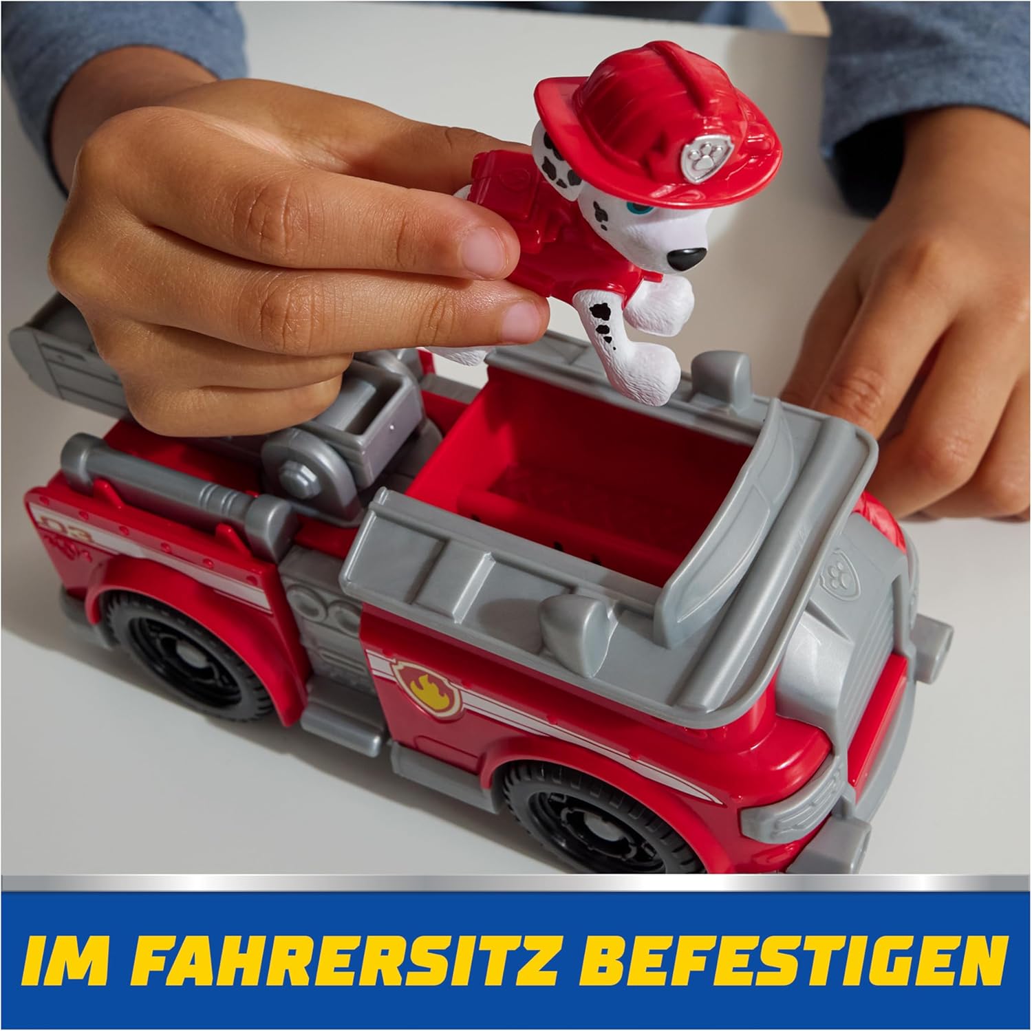 Paw Patrol Marshall fire truck toy with Marshall figure from Spin Master, featuring detailed rescue vehicle and character.