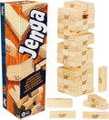 Hasbro Jenga game with wooden blocks stacked in a tower, ready for game play, on a plain background.