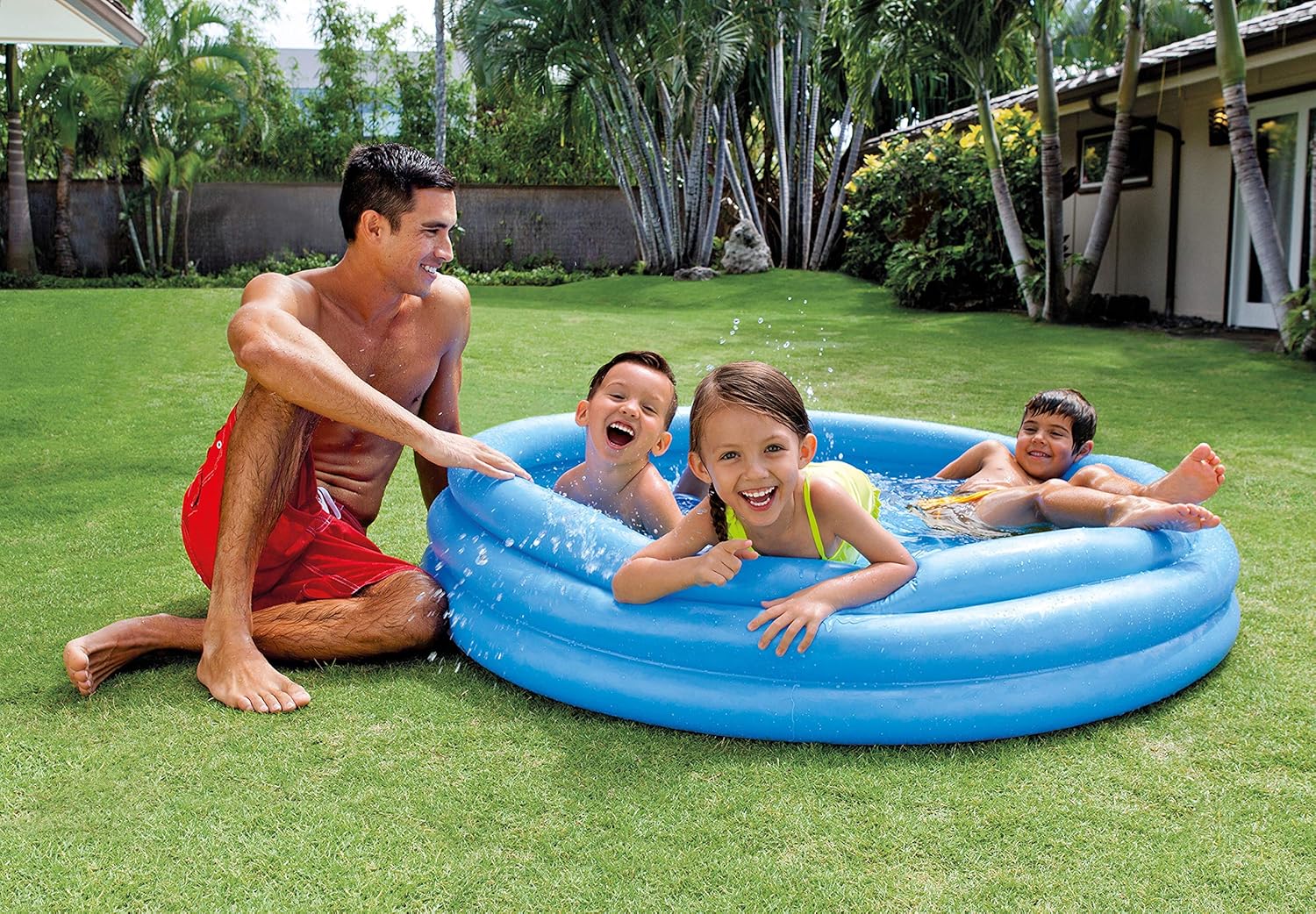 Playzokids Intex Recreation Crystal Blue Pool filled with water and set up outdoors, showcasing a large inflatable swimming pool.