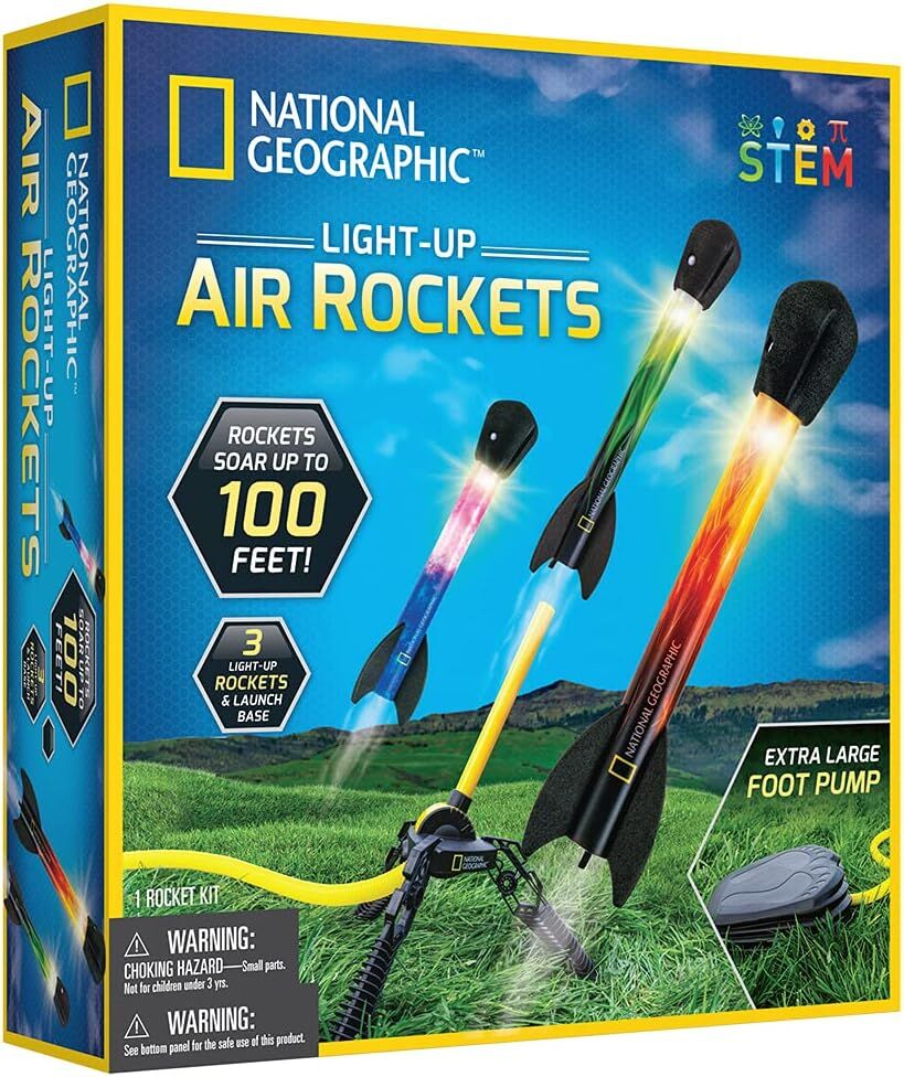 Playzokids National Geographic light-up air rockets flying outdoors with glowing effects in the night sky.