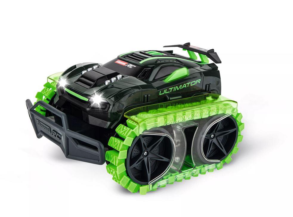 Carrera RC Ultimate Terrain Vehicle toy in green and black with large tires for off-road play, shown on rugged terrain.