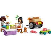 LEGO Friends hip road-trip travel car set 42659 with colorful car, travel accessories, and mini-figures on a scenic background.