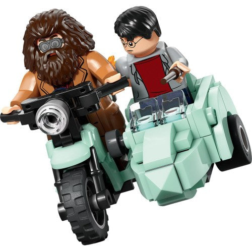 LEGO Harry Potter Hagrid and Harry escaping Privet Drive scene with minifigures and detailed LEGO set pieces.