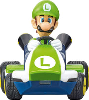 Carrera RC Mario Kart tabletop racing set featuring Mario and Luigi toy cars on a colorful track with detailed character figures.