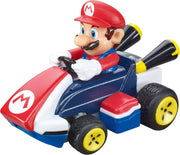 Carrera RC Mario Kart tabletop racing set featuring Mario and Luigi toy cars on a colorful track with detailed character figures.
