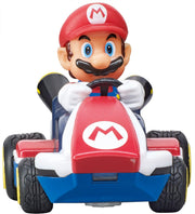 Carrera RC Mario Kart tabletop racing set featuring Mario and Luigi toy cars on a colorful track with detailed character figures.