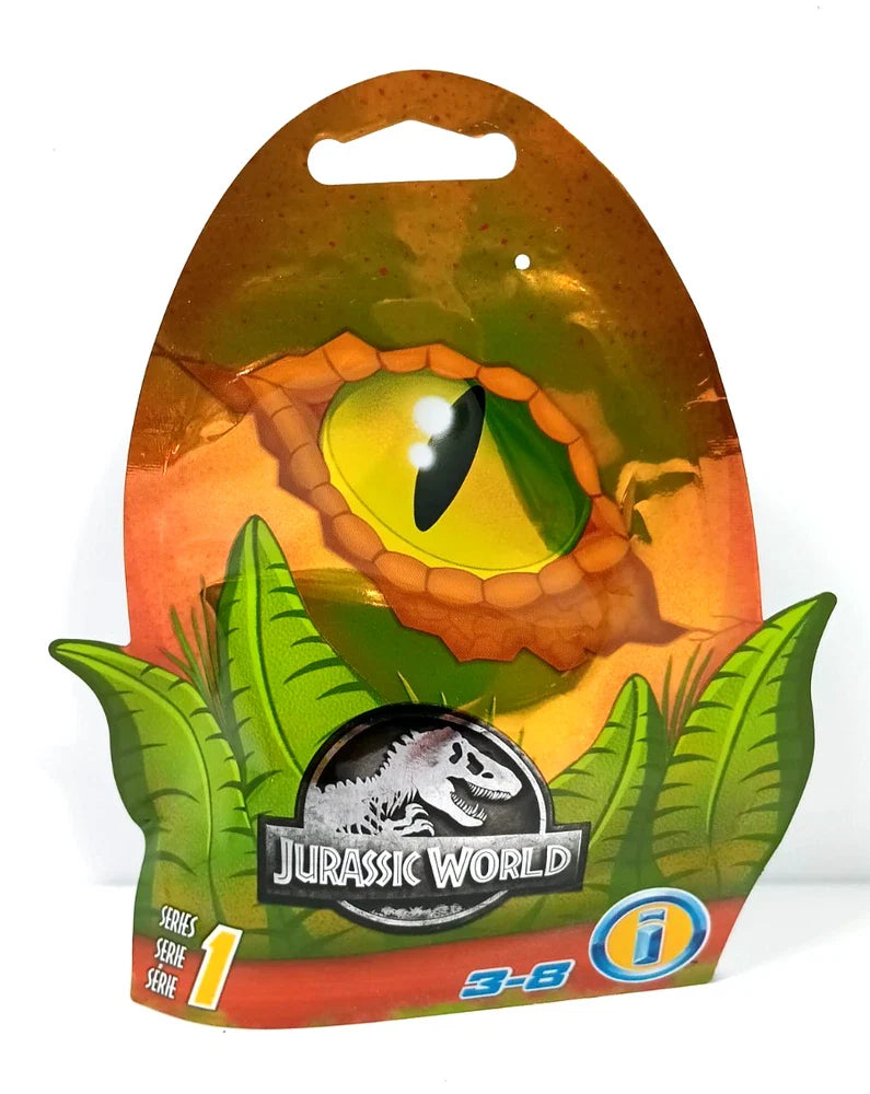 Jurassic World Series 1 blind box bag with surprise dinosaur toy featuring a colorful dinosaur figure on a white background.